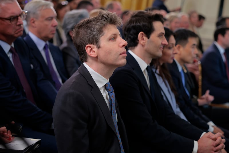 OpenAI CEO Sam Altman (L) attends a meeting of the White House Task Force on Artificial Intelligence Education in the East Room of the White House on September 04, 2025 in Washington, DC.