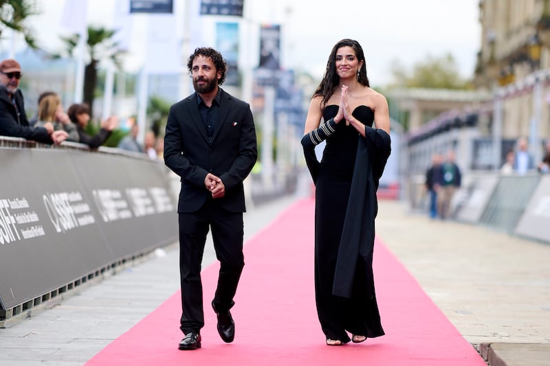 Stars of "The Voice of Hind Rajab," Motaz Malhees and Saja Kilani, attend the red carpet during the 73rd San Sebastian International Film Festival at Kursaal Palace on September 24, 2025, in San Sebastian, Spain.