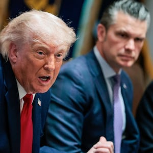U.S. President Donald Trump speaks next to Defense Secretary Pete Hegseth during a cabinet meeting in the Cabinet Room at the White House, in Washington, D.C.