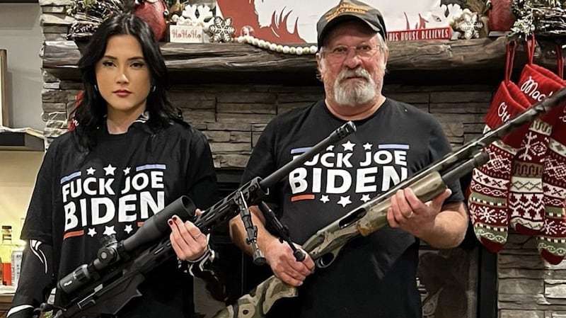 Beni Rae Harmony posing with a gun.