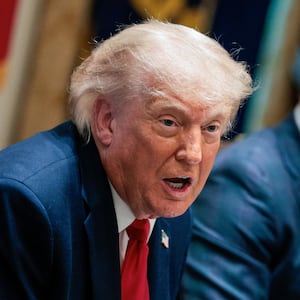 U.S. President Donald Trump speaks next to Defense Secretary Pete Hegseth during a cabinet meeting in the Cabinet Room at the White House, in Washington, D.C.