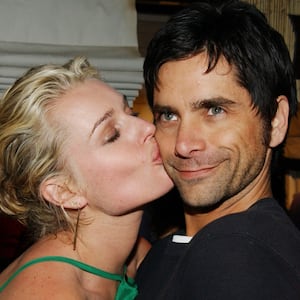 Rebecca Romijn-Stamos and John Stamos during PlayStation 2 "Bungalow Beach Party" at Viceroy Hotel in Santa Monica, California, United States. ***Exclusive*** (Photo by Jon Kopaloff/FilmMagic)
