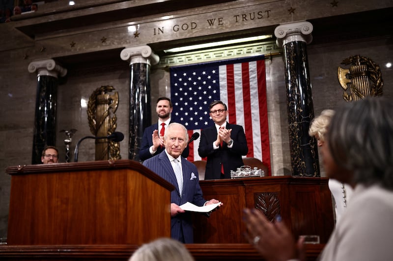 King Charles III standing in front of Vice President JD Vance and House Speaker Mike Johnson in the House chamber where he delivered an address a joint session of Congress on April 28, 2026.