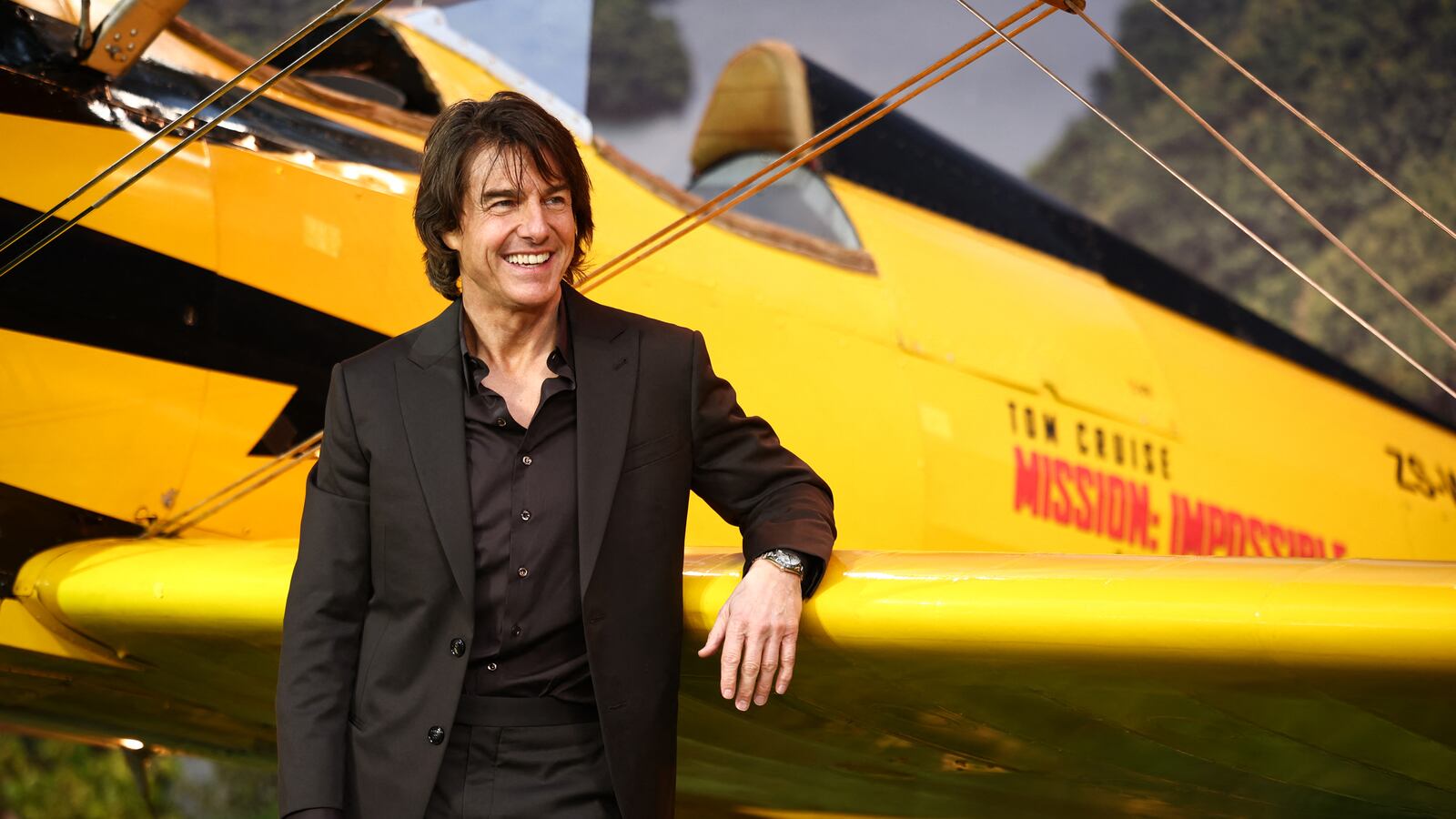 TOPSHOT - US actor Tom Cruise poses on the red carpet by a plane upon arrival for the Global Premiere of "Mission: Impossible - The Final Reckoning" at Leicester Square Gardens in central London, on May 15, 2025. (Photo by HENRY NICHOLLS / AFP) (Photo by HENRY NICHOLLS/AFP via Getty Images)