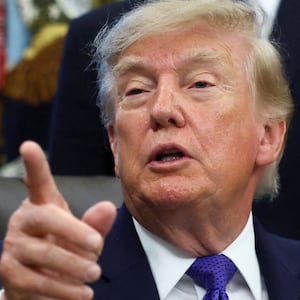 Donald Trump takes questions from the press in the Oval Office early this week.