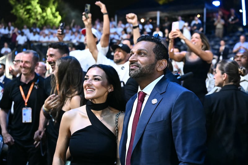 FBI Director Kash Patel stands with singer Alexis Wilkins at the conclusion of the "UFC Freedom 250" mixed martial arts event on the South Lawn of the White House in Washington, DC, in the early morning hours of June 15, 2026. (Photo by Kent NISHIMURA / AFP via Getty Images)