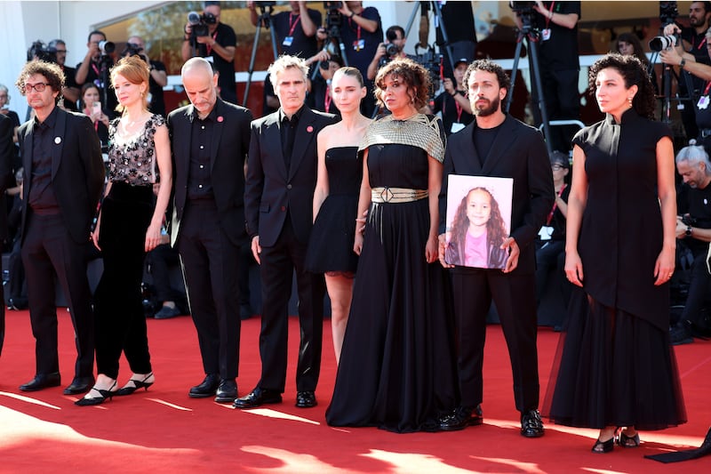 Nadim Cheikhrouha, Odessa Rae, James Wilson, Joaquin Phoenix, Mara Rooney, Kaouther Ben Hania, Motaz Malhees and Clara Khoury attend the "The Voice Of Hind Rajab" red carpet during the 82nd Venice International Film Festival.