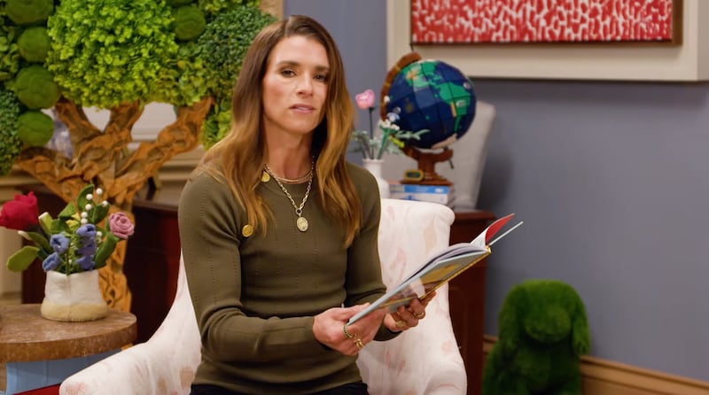 Danica Patrick holding a book