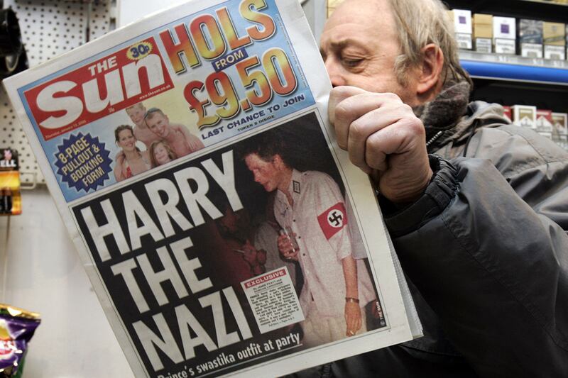 galleries/2012/06/02/queen-elizabeth-s-diamond-jubilee-the-scandals-she-has-endured-photos/queens-scandals-prince-harry-tabloid_odjljb