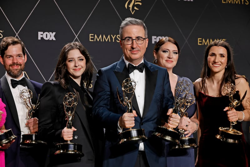 John Oliver and his team holding Emmys for their work on "Last Week Tonight With John Oliver" in 2024