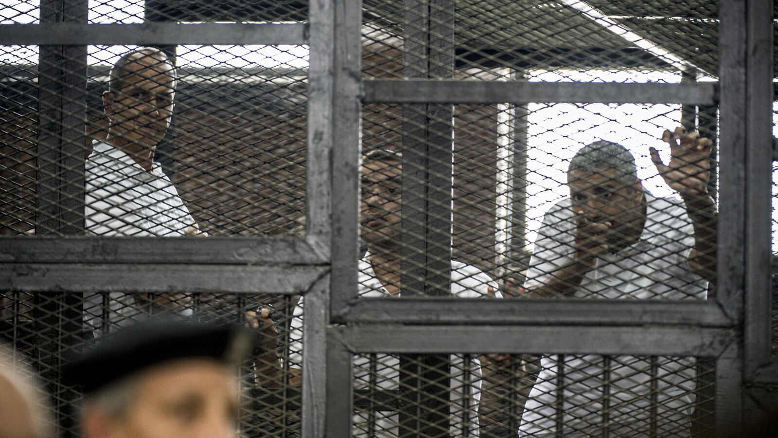 articles/2014/06/23/egyptian-court-hands-down-stiff-sentences-for-al-jazeera-journalists/140623-rosenfeld-egypt-journalists-tease_rkglwg