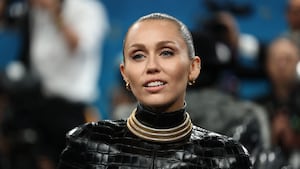 Miley Cyrus poses during the Met Gala, an annual fundraising gala held for the benefit of the Metropolitan Museum of Art's Costume Institute with this year's theme 'Superfine: Tailoring Black Style,' in New York City, New York, U.S., May 5, 2025. REUTERS/Mario Anzuoni