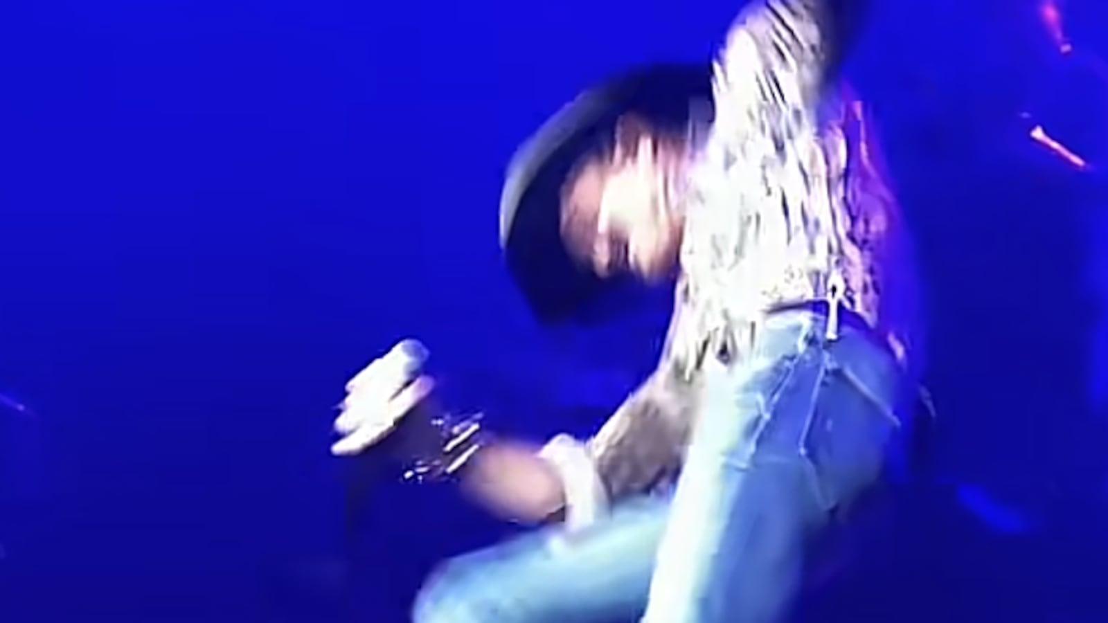 Tim McGraw falls on stage.