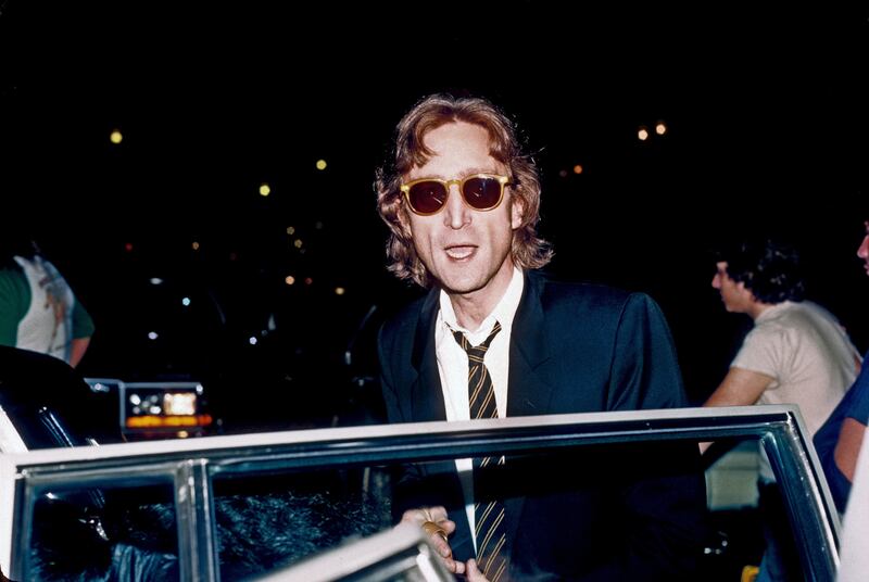 NEW YORK - AUGUST 1980: Former Beatle John Lennon arrives at the Times Square recording studio 'The Hit Factory' before a recording session of his final album 'Double Fanasy' in August 1980 in New York City, New York.