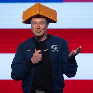 Musk arrived to a Green Bay town hall wearing a cheesehead hat.
