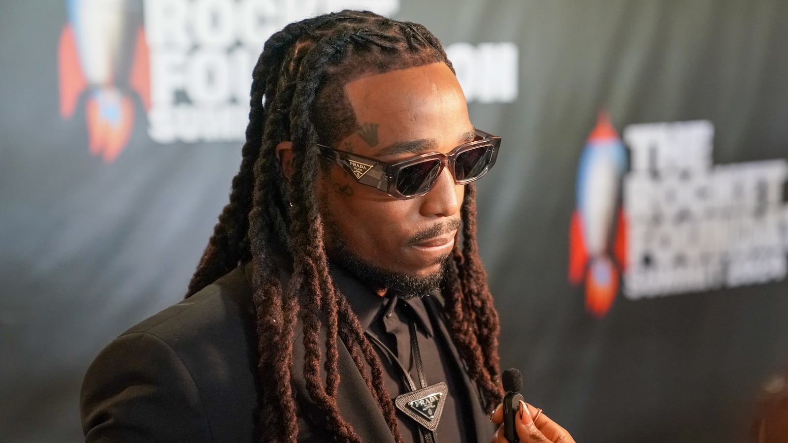 Quavo speaks to the media.