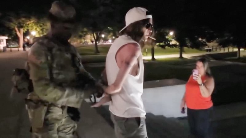 Three people are arrested by National Guards after a bizarre photo shoot at Donald Trump’s botched reflecting pool.