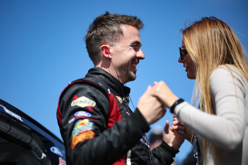 Frankie Muniz, driver of the #30 Hair Club Ford, and wife, Paige Price Muniz in 2023.