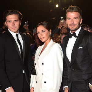 From left: Brooklyn Beckham, Victoria Beckham and David Beckham attend the GQ magazine's 2019 "Men of the Year" Awards at the Tate Modern on September 3, 2019 in London.