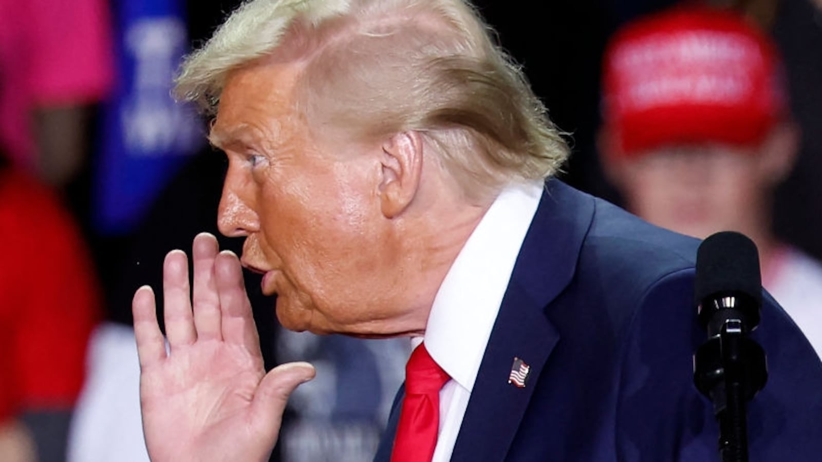 Former US President and Republican presidential candidate Donald Trump gestures as he speaks during a campaign rally at Van Andel Arena in Grand Rapids, Michigan on November 5, 2024.