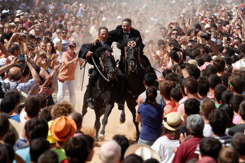 galleries/2013/06/29/week-in-photos-june-29-2013/130627-spain-guys-horses-wip_qtr3pa