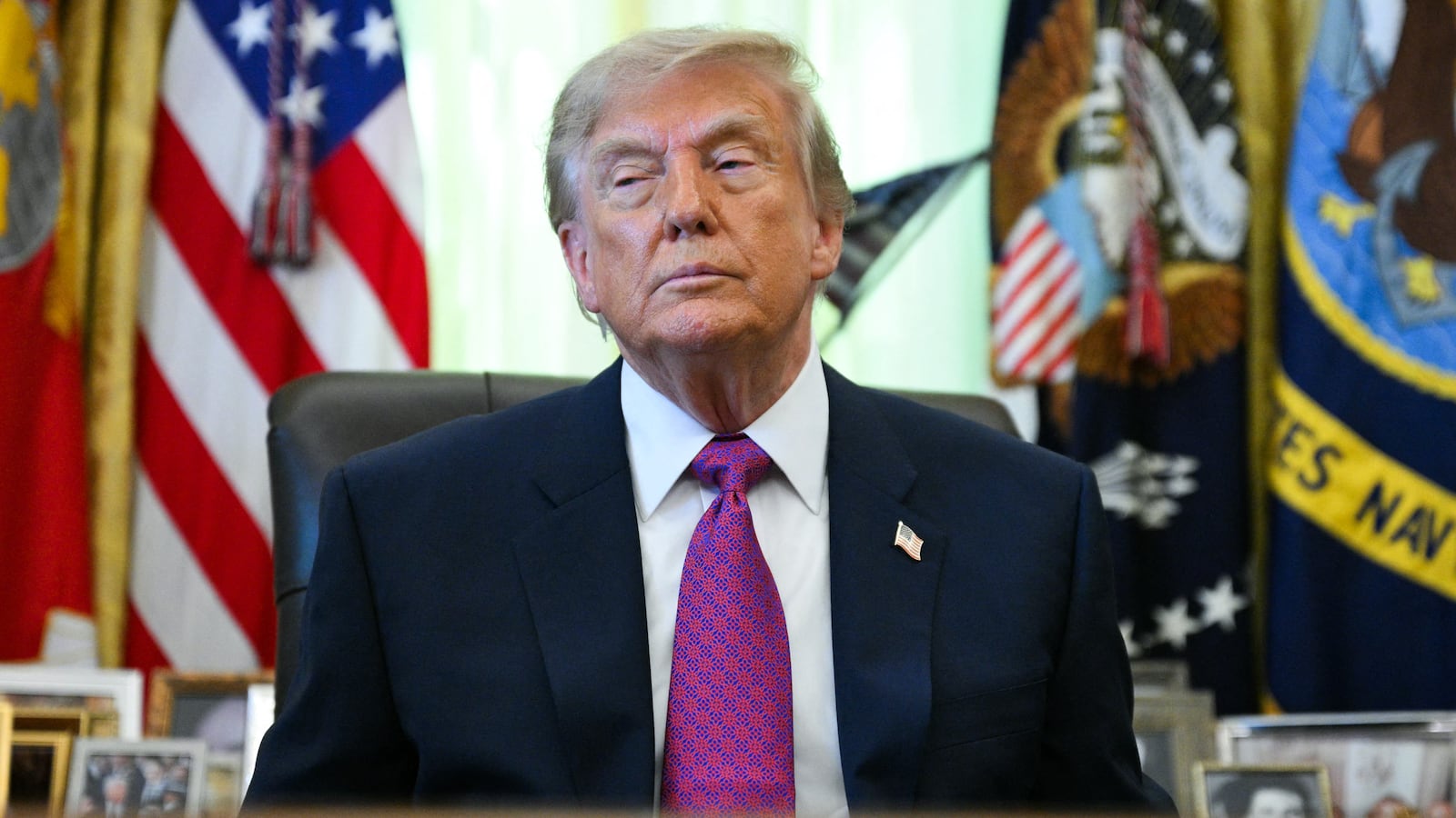 US President Donald Trump speaks after signing an executive order that aims to rename Lake Ontario to Lake America in the Oval Office of the White House in Washington, DC, on August 27, 2026. (Photo by Jim WATSON / AFP via Getty Images)