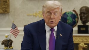 President Donald Trump "reads" to children from the Oval Office.