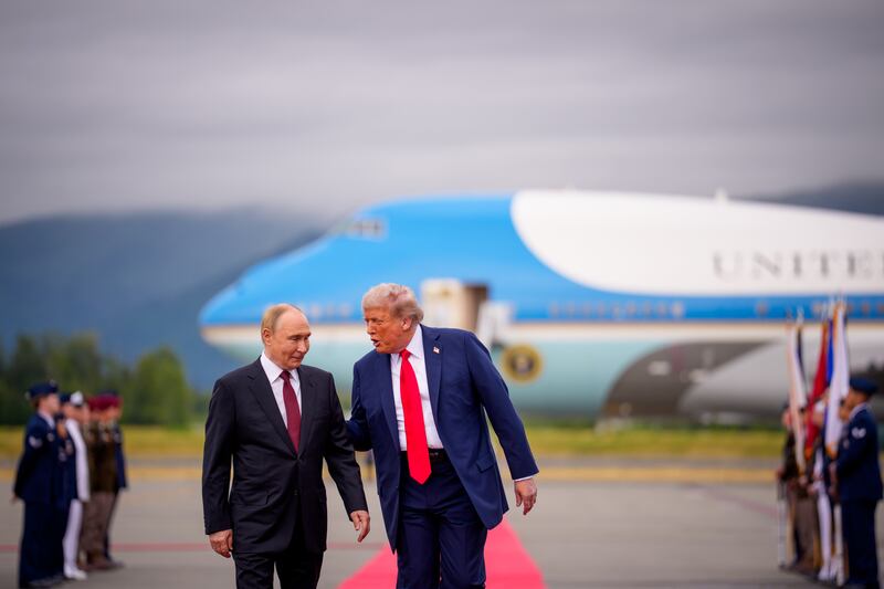 President Donald Trump greets Russian President Vladimir Putin as he arrives for a meeting on August 15, 2025 in Anchorage, Alaska. The two leaders held peace talks aimed at ending the war in Ukraine.