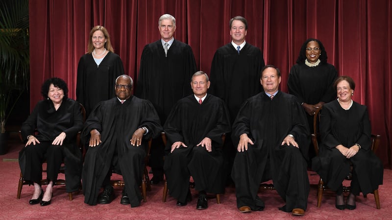 Justices of the US Supreme Court pose for their official photo at the Supreme Court in Washington, DC on October 7, 2022. (Seated from left) Associate Justice Sonia Sotomayor, Associate Justice Clarence Thomas, Chief Justice John Roberts, Associate Justice Samuel Alito and Associate Justice Elena Kagan, (Standing behind from left) Associate Justice Amy Coney Barrett, Associate Justice Neil Gorsuch, Associate Justice Brett Kavanaugh and Associate Justice Ketanji Brown Jackson. (Photo by OLIVIER DOULIERY / AFP) (Photo by OLIVIER DOULIERY/AFP via Getty Images)