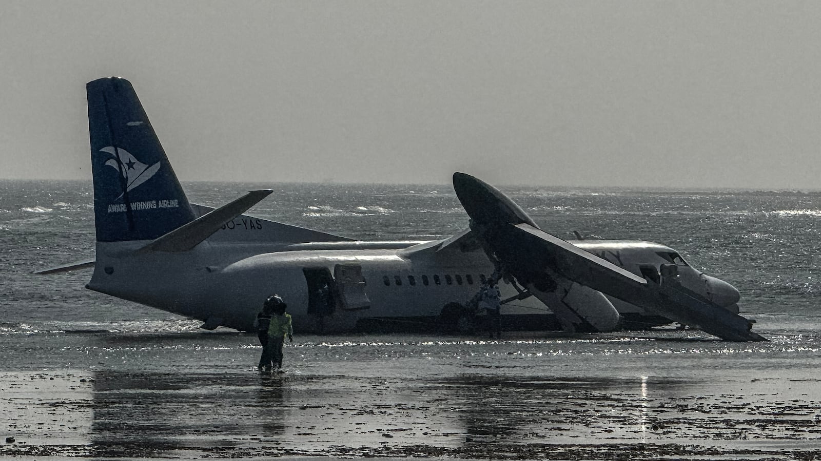 Emergency personnel are seen at the site of the crash of a StarSky airliner after it plunged shorlty after taking off with 55 passengers on board in Mogadishu, on February 10, 2026. (Photo by AFP via Getty Images)