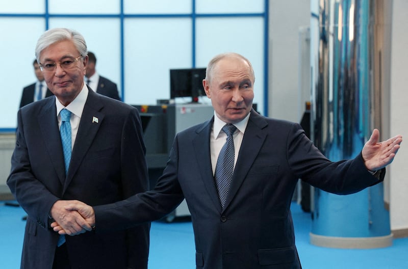 Russian President Vladimir Putin welcomes Kazakh President Kassym-Jomart Tokayev before a session of the 22nd Russia–Kazakhstan Interregional Cooperation Forum in Omsk, Russia, July 25, 2026.