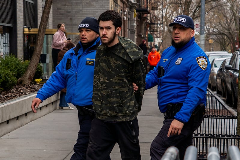 Counter-protester Ibrahim Kayumi is detained by New York Police Department (NYPD) officers outside Gracie Mansion, the official residence of New York Mayor Zohran Mamdani, during an anti-Islam protest led by far-right activist Jake Lang in New York City, New York, U.S., March 7, 2026. Police said two individuals were arrested and are under investigation after homemade explosive devices were thrown during the demonstration. REUTERS/Madison Swart