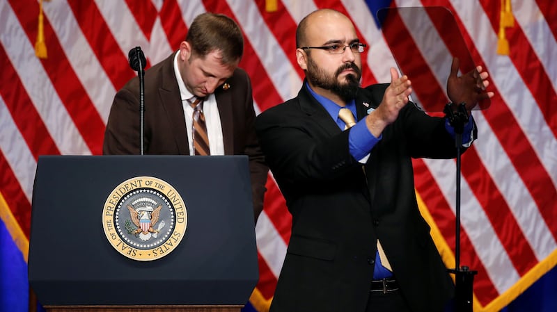 Gabriel Perez adjusts the teleprompter before President Donald Trump delivers remarks regarding the Administration's National Security Strategy at the Ronald Reagan Building and International Trade Center in Washington D.C on December 18, 2017.