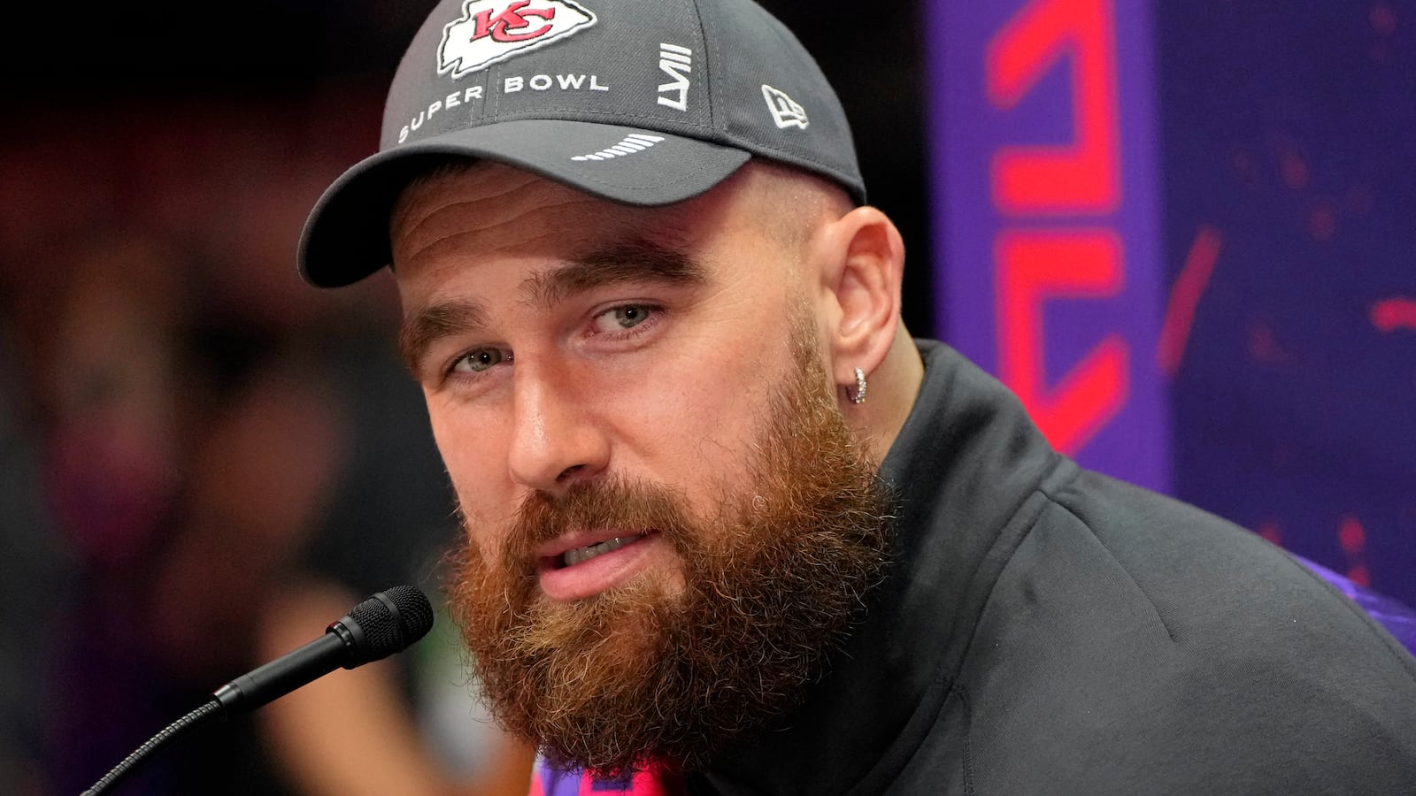 Kansas City Chiefs tight end Travis Kelce (87) talks to the media during Super Bowl LVIII Opening Night.