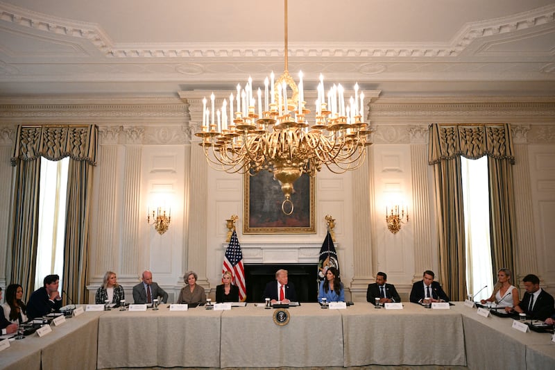 TOPSHOT - US President Donald Trump (C) chairs a roundtable about Antifa in the State Dining Room of the White House in Washington, DC, on October 8, 2025. (Photo by Jim WATSON / AFP) (Photo by JIM WATSON/AFP via Getty Images)