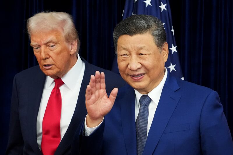 BUSAN, SOUTH KOREA - OCTOBER 30: U.S. President Donald Trump and Chinese President Xi Jinping react after posing for photos ahead of a bilateral meeting at Gimhae Air Base on October 30, 2025 in Busan, South Korea. Trump is meeting Xi for the first time since taking office for his second term, following months of growing tension between both countries. (Photo by Andrew Harnik/Getty Images)