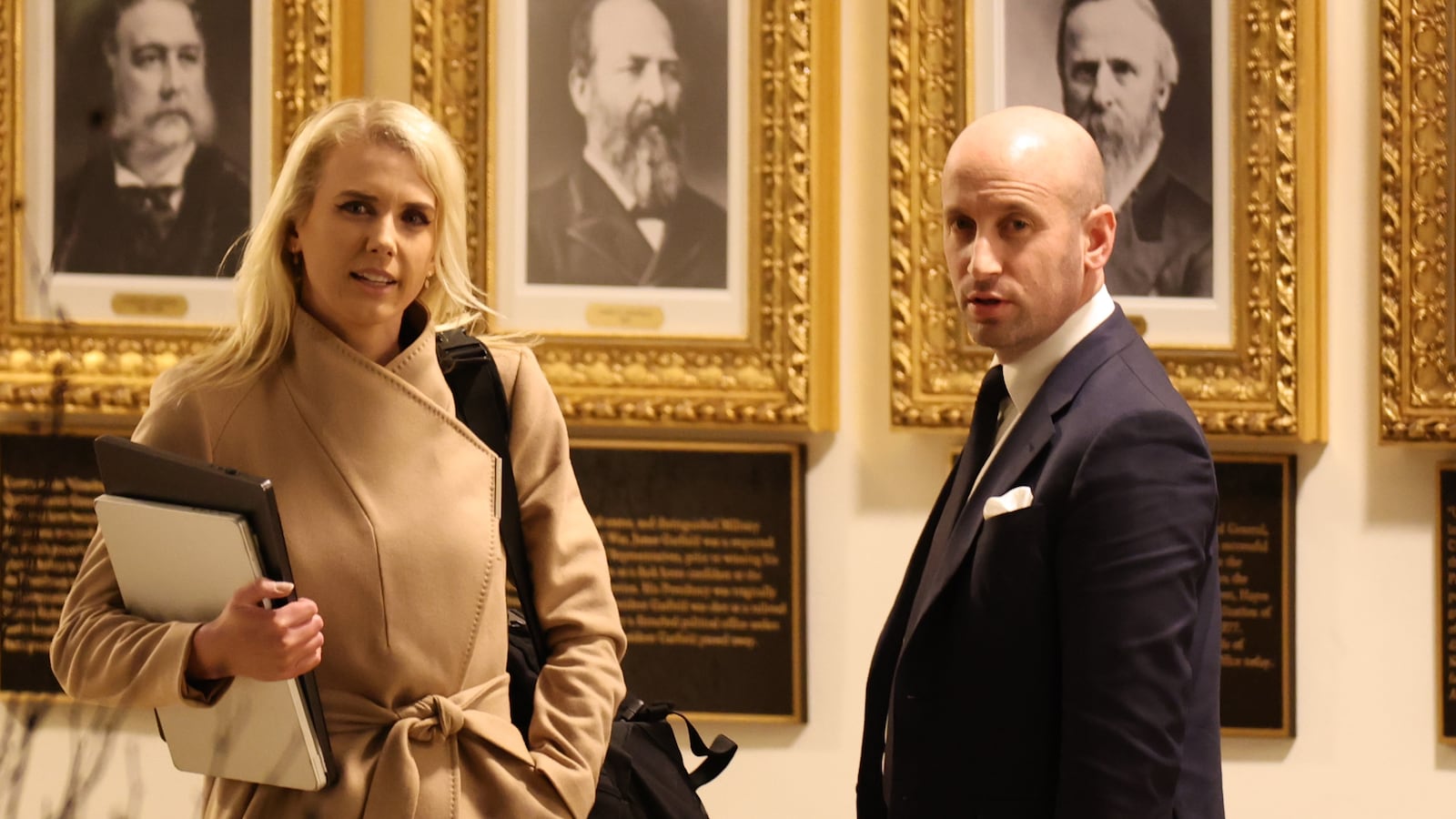 WASHINGTON, DC - MARCH 01: Executive assistant to the President Natalie Harp and U.S Homeland Security Advisor and White House Deputy Chief of Staff Stephen Miller return to the White House on March 01, 2026 in Washington, DC. On Saturday, President Trump announced that the United States and Israel had launched strikes on Iran targeting political and military leaders, as well as Iran's ballistic missile and nuclear programs. (Photo by Tasos Katopodis/Getty Images)