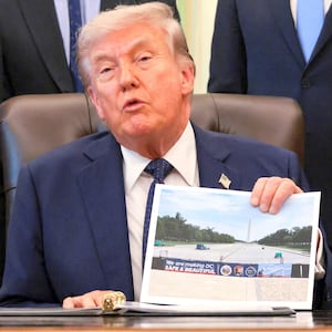 U.S. President Donald Trump shows an image and speaks about renovations at the Lincoln Memorial Reflecting Pool in the Oval Office at the White House in Washington, D.C., U.S., April 23, 2026.