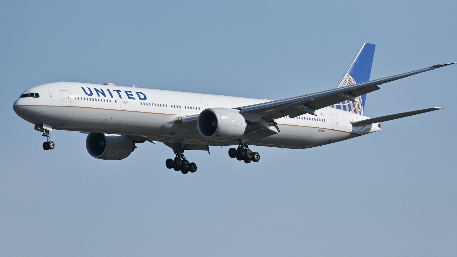 A United Airlines Boeing 777-300ER plane prepares for landing at the Capital International airport in Beijing on October 22, 2024.