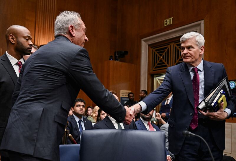 U.S. Health and Human Services (HHS) Secretary Robert F. Kennedy Jr. shakes hands with U.S. Senator Bill Cassidy (R-LA) during a Senate Health, Education, Labor, and Pensions Committee hearing on U.S. President Donald Trump's budget request for the Department of Health and Human Services