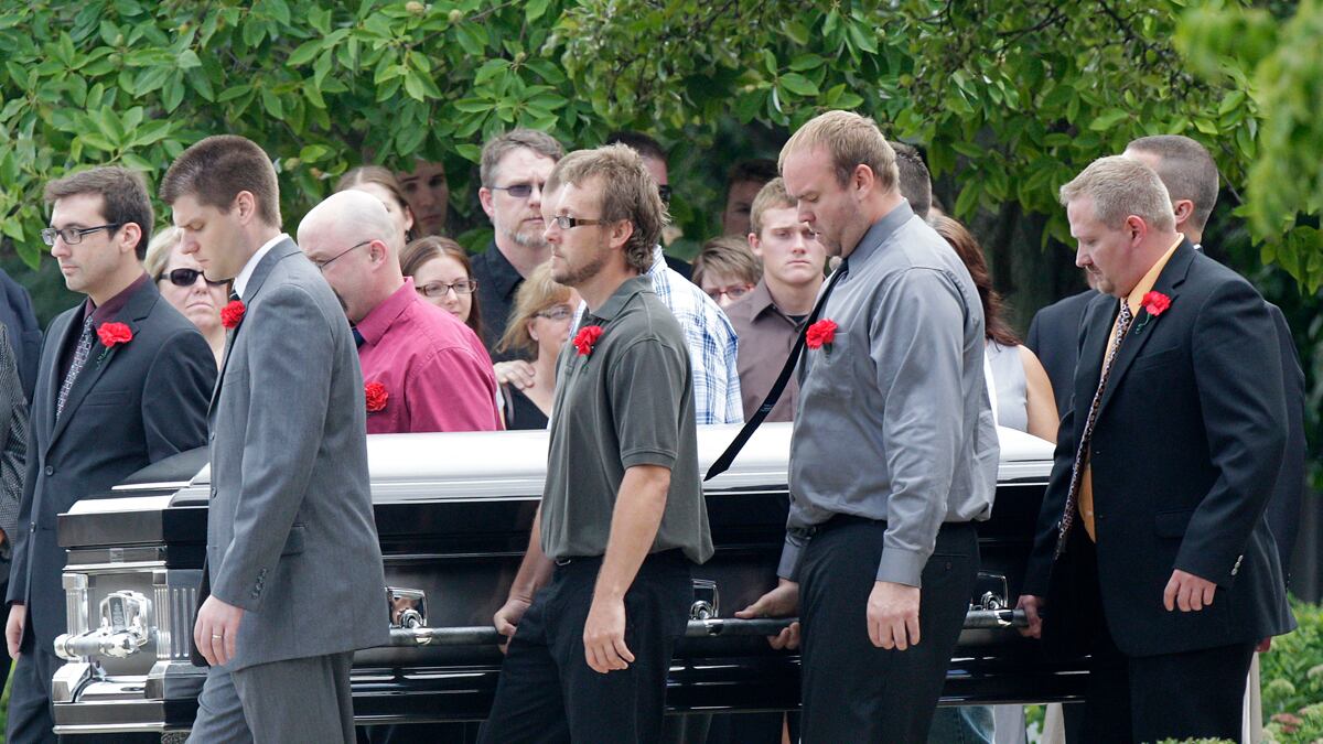 cheats/2012/07/28/two-victims-remembered/colorado-shooting-funeral-mcquinn-cheat_cmatn8