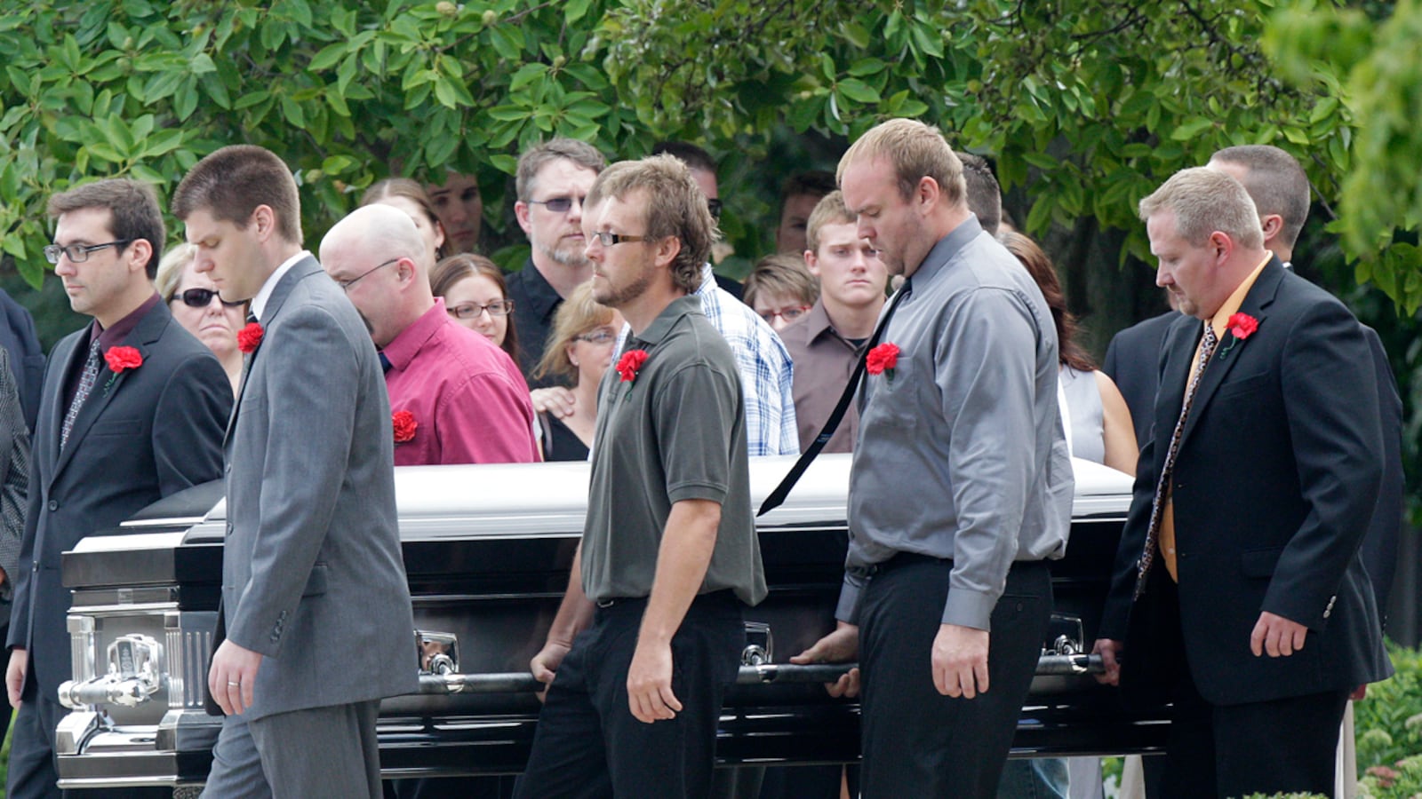 cheats/2012/07/28/two-victims-remembered/colorado-shooting-funeral-mcquinn-cheat_cmatn8