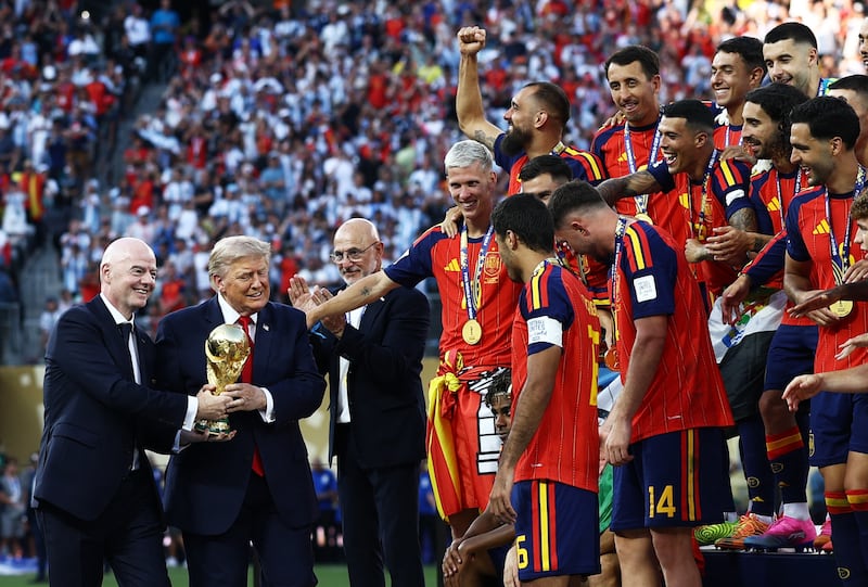 Soccer Football - FIFA World Cup 2026 - Final - Spain v Argentina - New York/New Jersey Stadium, East Rutherford, New Jersey, U.S. - July 19, 2026 U.S. President Donald Trump and FIFA President Gianni Infantino with the World Cup trophy during the trophy presentation REUTERS/Lee Smith