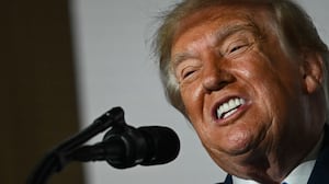 U.S. President Donald Trump signs an executive order during the America.gov launch event at Andrew W. Mellon Auditorium on September 29, 2026 in Washington, DC.