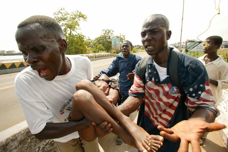 galleries/2012/04/26/charles-taylor-verdict-liberian-warlord-s-alleged-atrocities-photos/liberia-civilians-flee-2003_ph5fzu