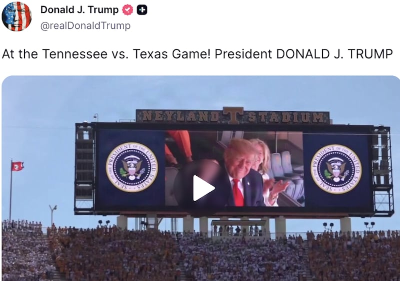 Trump posts a photo of "President DONALD J. TRUMP" smiling broadly at the game.