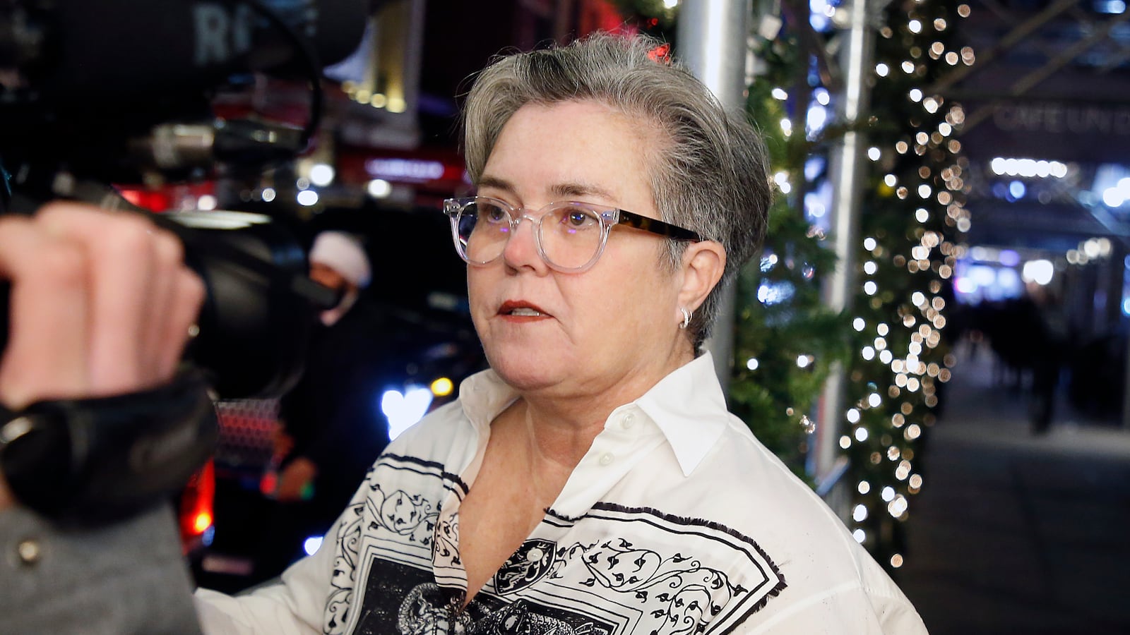 Rosie O'Donnell looking at a camera.