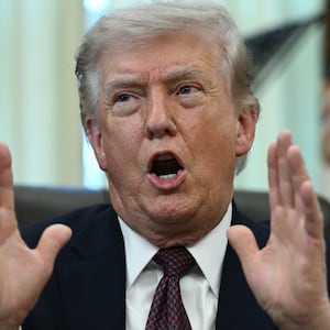 US President Donald Trump speaks after signing an executive order in the Oval Office of the White House in Washington, DC, on March 31, 2026. (Photo by Brendan SMIALOWSKI / AFP via Getty Images)