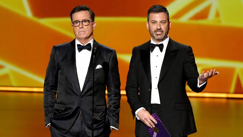 LOS ANGELES, CALIFORNIA - SEPTEMBER 22: Stephen Colbert and Jimmy Kimmel speak onstage during the 71st Emmy Awards at Microsoft Theater on September 22, 2019 in Los Angeles, California. (Photo by Amy Sussman/WireImage)