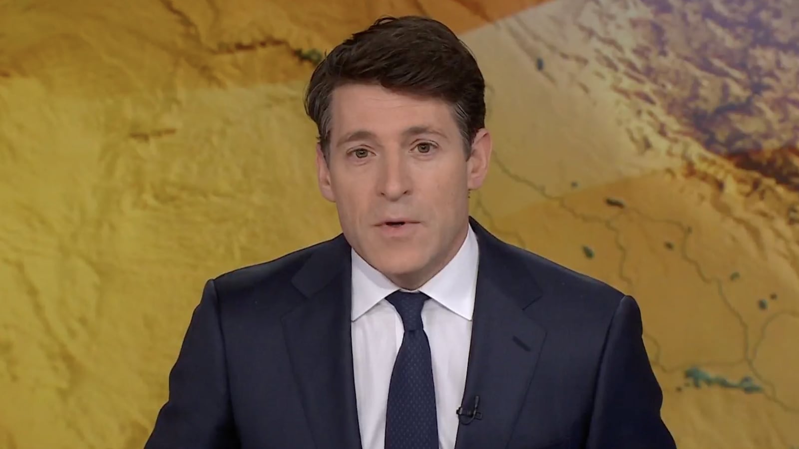 Tony Dokoupil presents a special broadcast covering the U.S. and Israel attacks on Iran in a suit and tie from his anchor desk.
